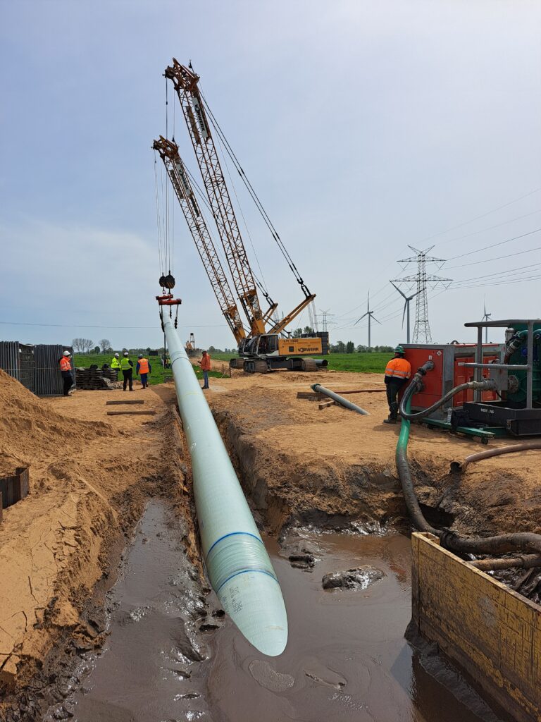 HDD trenchless installation of a pau wrap cladding protected pipeline